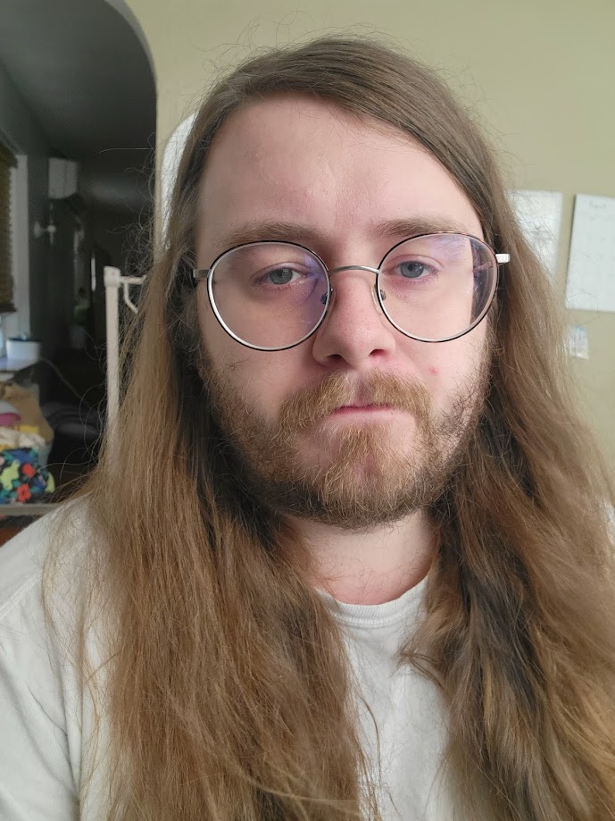 a profile picture of a long hair mcandrew